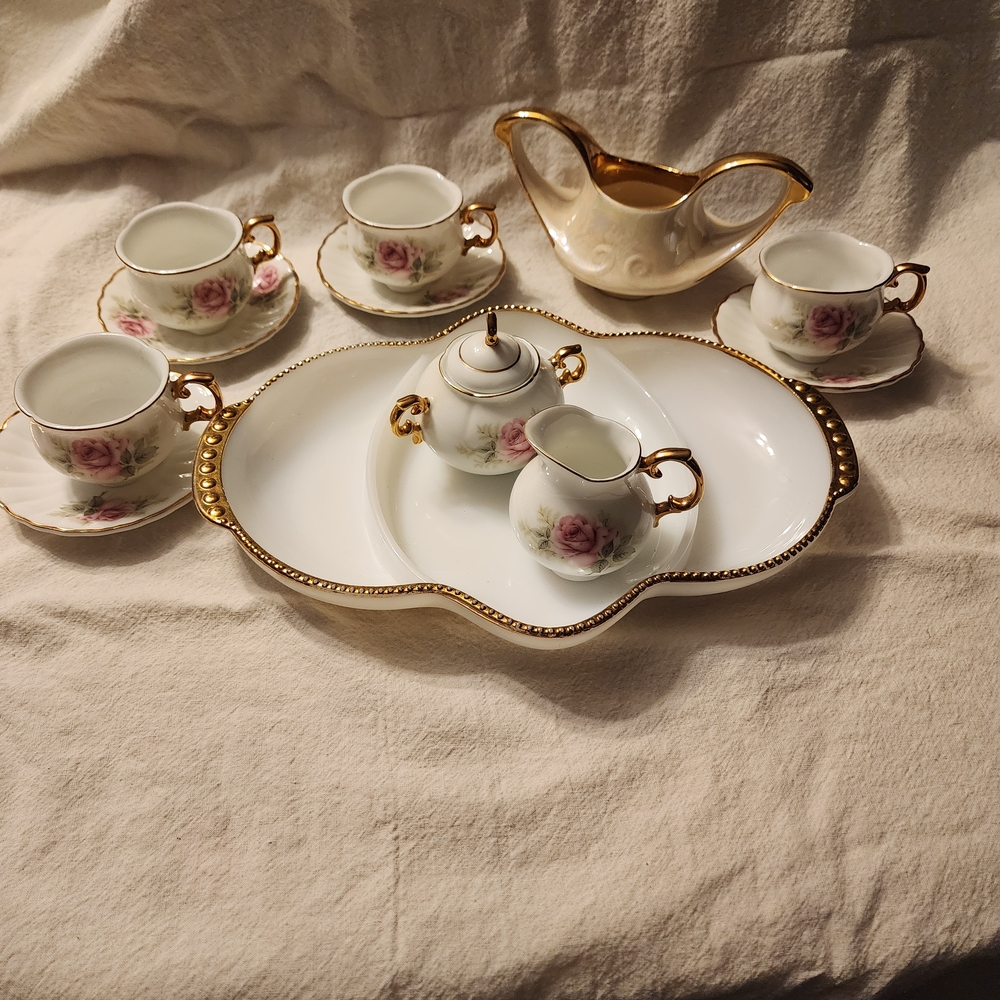 Elegant Gold and White Tea Set with Floral Design